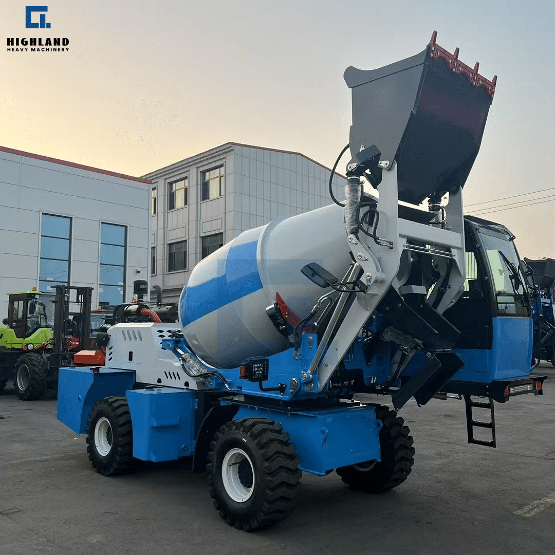 HIGHLAND HEAVY MACHINERY blue and white self loading concrete mixer truck with a raised high-discharge hopper, parked in a factory yard at dusk, showcasing efficient material loading and robust design for construction projects.