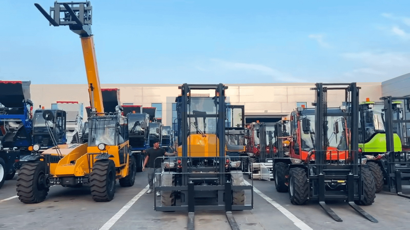 HIGHLAND HEAVY MACHINERY multi-color rough terrain forklift fleet lined up in the factory yard, including yellow, black, and red models, showcasing diverse product inventory and brand manufacturing strength for About Us page display.