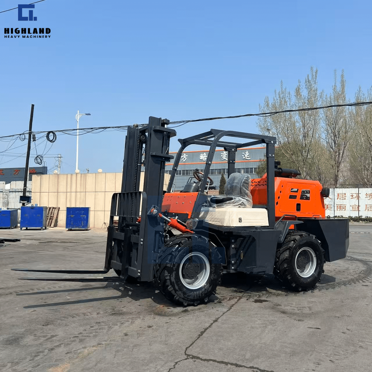 HIGHLAND HEAVY MACHINERY brand new orange and black rough terrain forklift with a blue mast, featuring a factory protective film on the seat, parked in an industrial yard for global shipping.