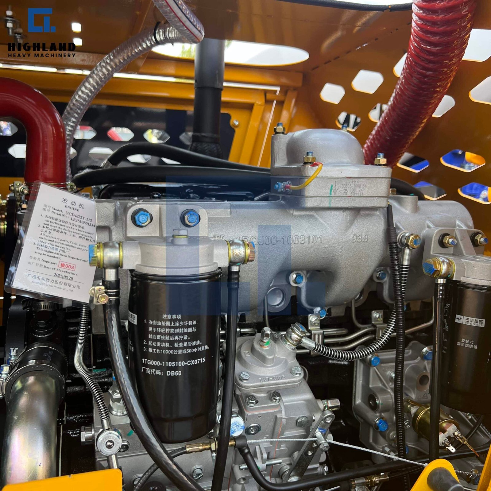 HIGHLAND HEAVY MACHINERY self loading concrete mixer truck diesel engine close-up, featuring a genuine Yuchai engine nameplate, heavy-duty oil filters, and robust high-pressure fuel lines for reliable power output.